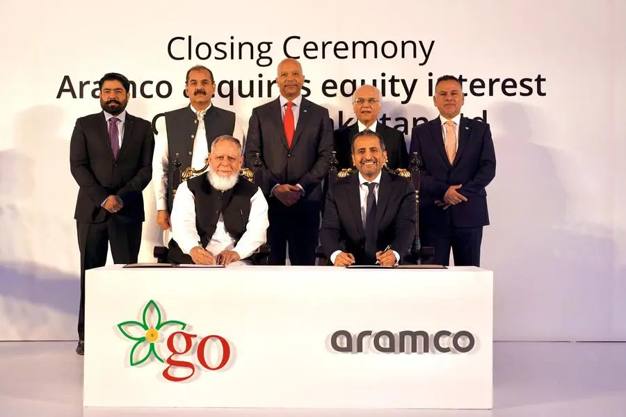 At the closing ceremony are GO CEO Khalid Riaz, sitting left, and Aramco International Retail Director Nader Douhan, sitting right. Standing, from left, are GO board members Bilal Ansari and Shahzad Mubeen, Aramco Executive Vice President of Products & Customers Yasser Mufti, GO Chairman Tariq Kirmani, and Aramco Vice President of Retail Ziyad Juraifani. Image courtesy: Aramco